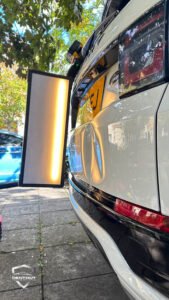 Dent Removal West London – Before the dent was removed from a customer’s car in West London, PDR light reflecting the dent clearly.